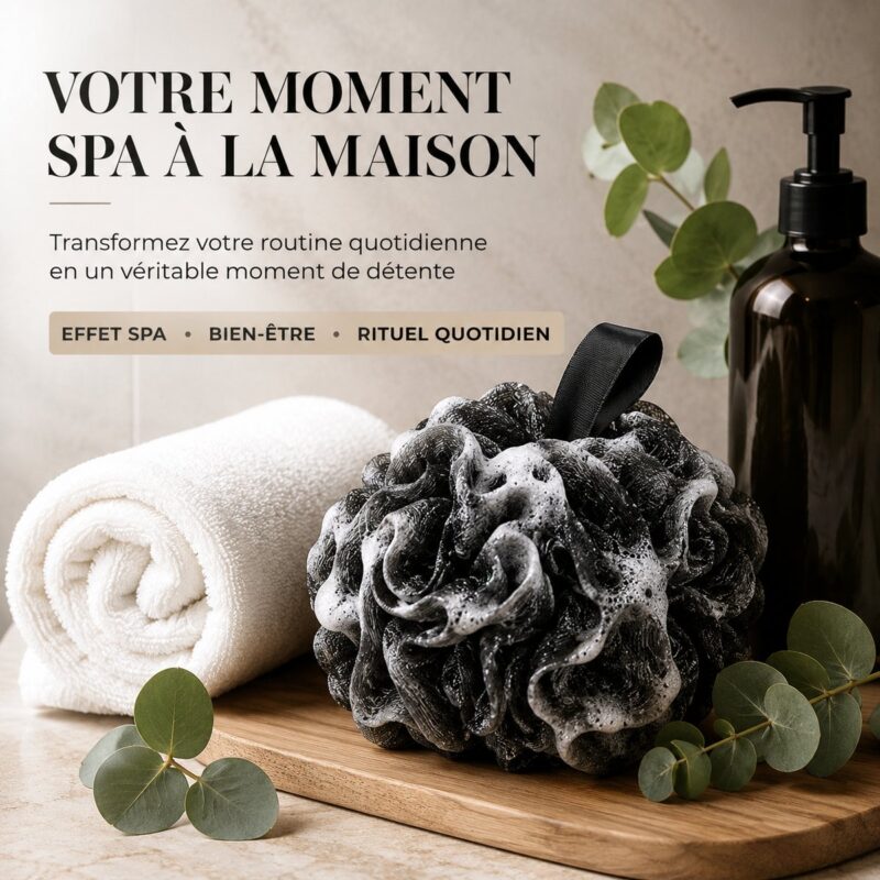 Fleur de douche noire posée sur une planche en bois, entre une serviette blanche et de l'eucalyptus